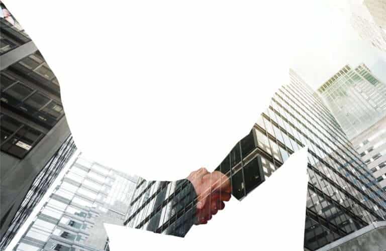 Business handshake and business people on background